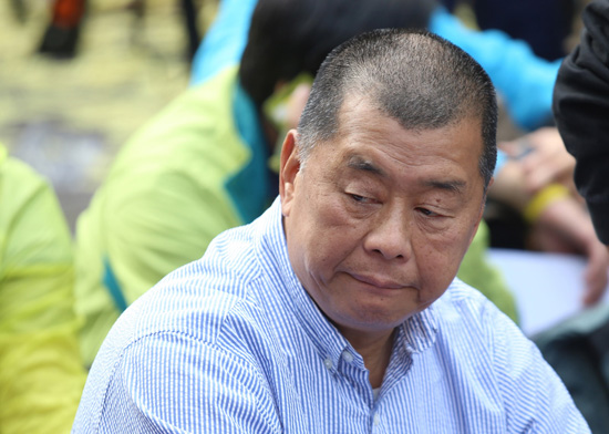 ,壹传媒创办人黎智英涉违法占中被捕